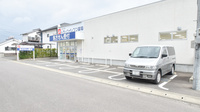 ドラッグイレブン薬局築城店の駐車場